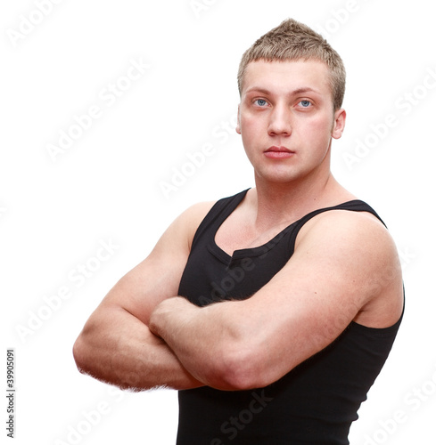 One handsome musculan man with clasped hands on white background