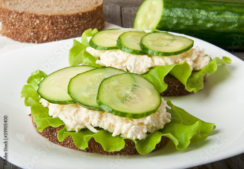 Healthy sandwich with cucumber and egg with cheese for breakfast