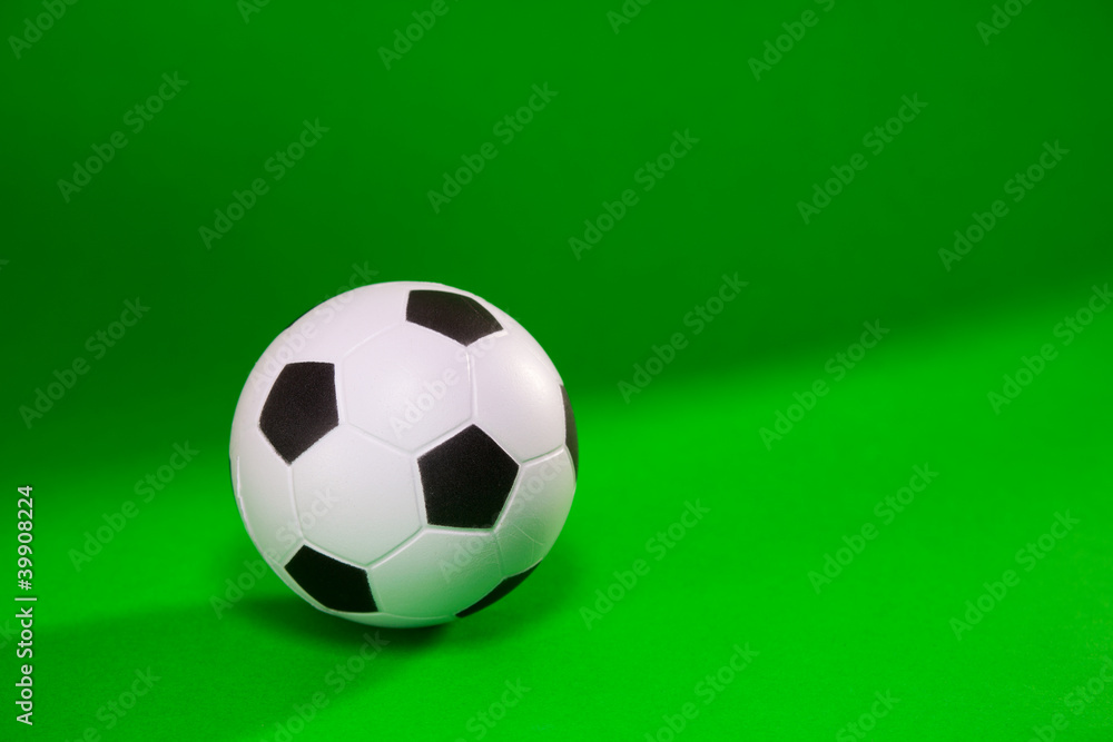 Small soccer ball over green background Small soccer ball over green background