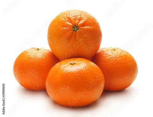 Four fresh and tasty oranges on a white background