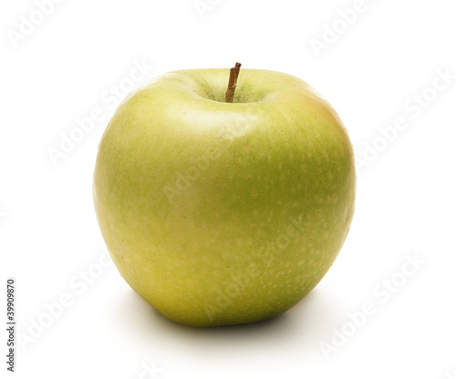 A fresh green apple isolated on a white background