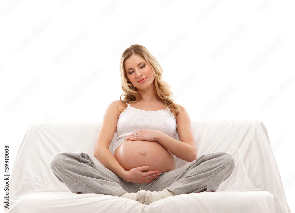 A young and happy pregnant blond Caucasian woman A young and happy pregnant blond Caucasian woman