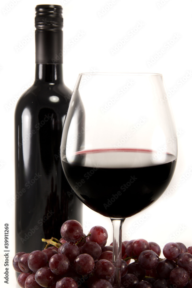 Clean shot of red wine and grapes