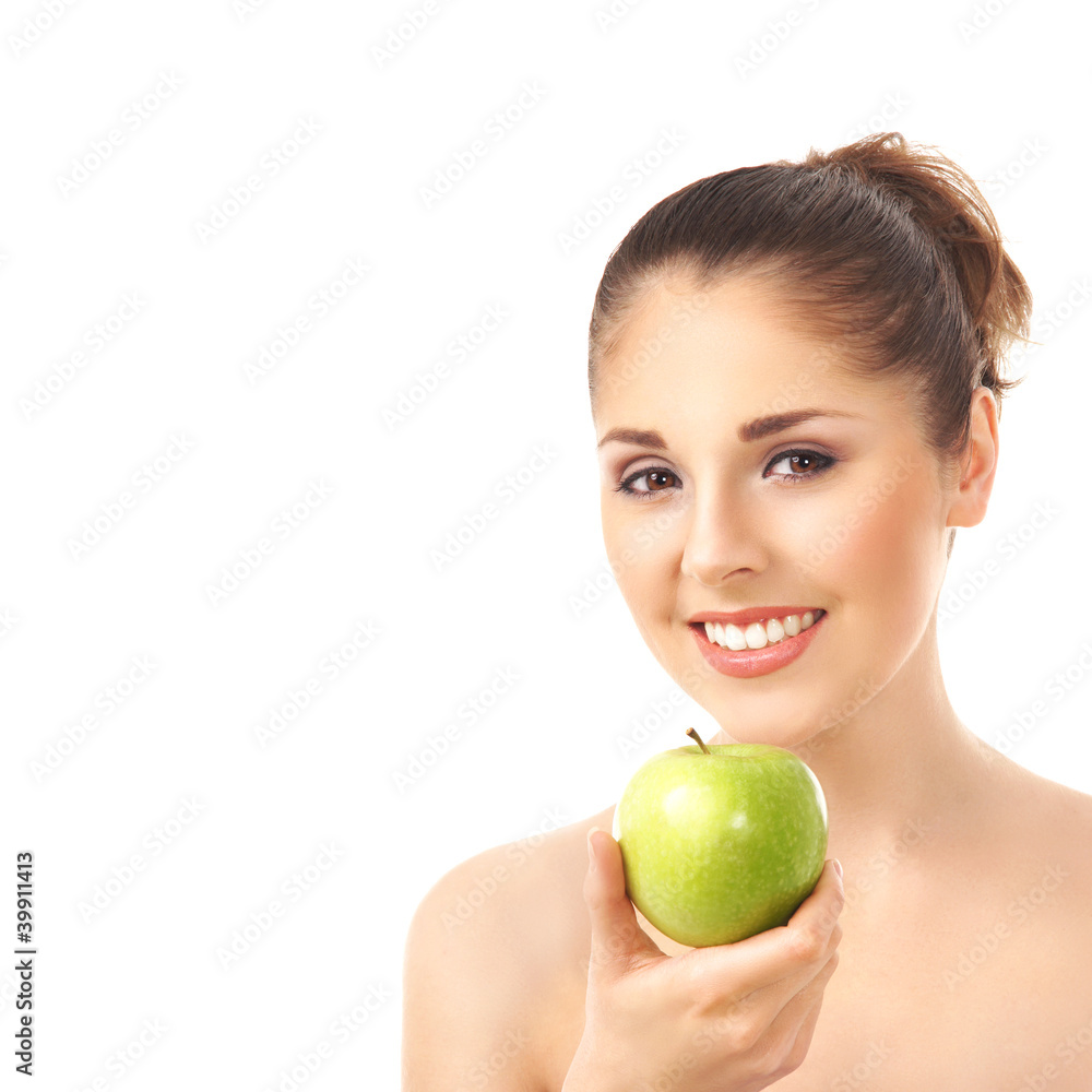 A young and happy woman holding an apple A young and happy woman holding an apple