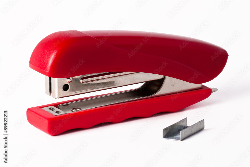 Isolated red stapler with staples Isolated red stapler with staples