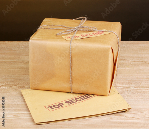 Parcel and envelope with top secret stamp photo