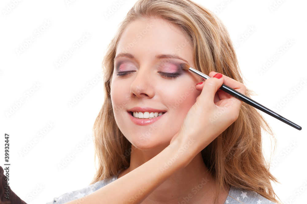 studio shot of lovely young woman having make up studio shot of lovely young woman having make up