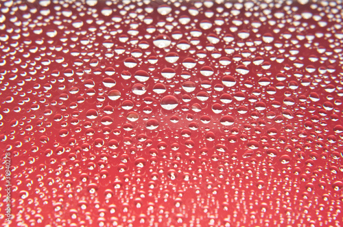 Water drops on glass red and white color photo