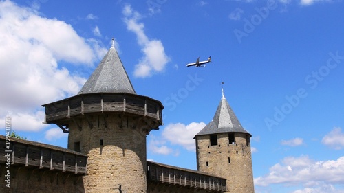 Aircraft between the towers of the city of Carcassonne
