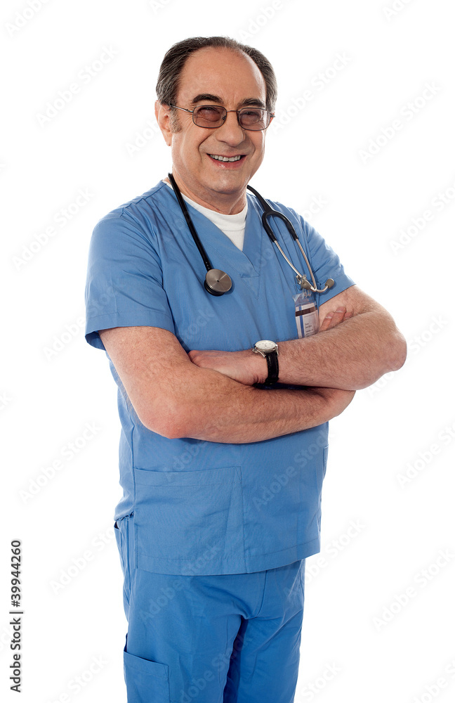 Smiling matured doctor posing with folded arms Smiling matured doctor posing with folded arms