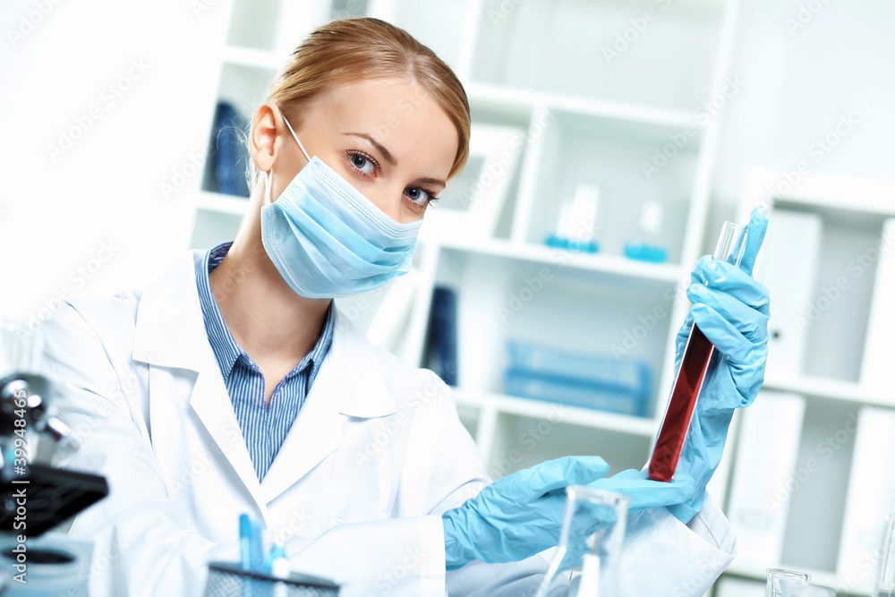 Young scientist working in laboratory Young scientist working in laboratory