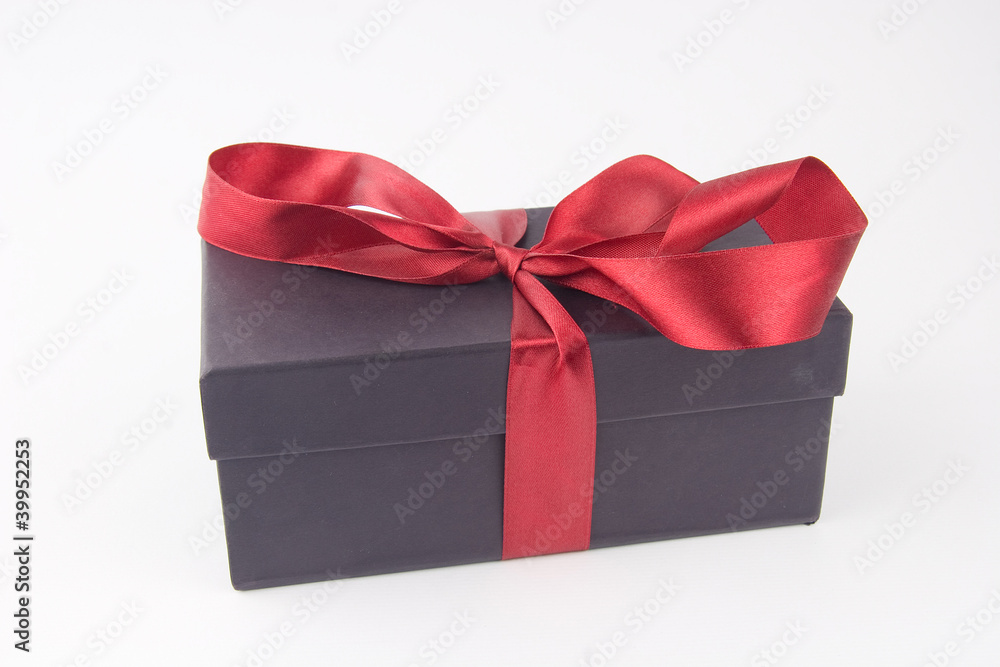 Gift box with a red bow and ribbon Gift box with a red bow and ribbon
