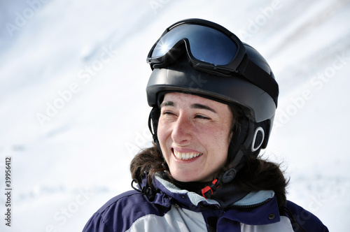 Portrait of a smiling skier woman with helmet © salajean