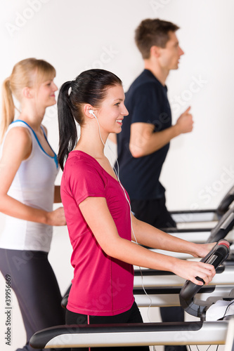 Young people on treadmill running exercise