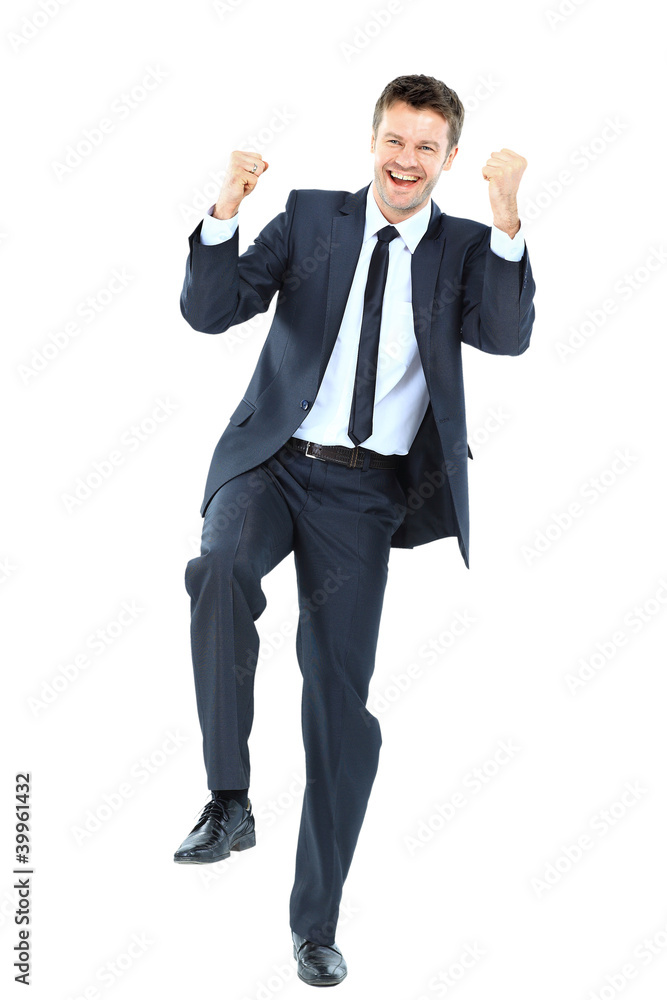 Excited handsome business man with arms raised in Excited handsome business man with arms raised in