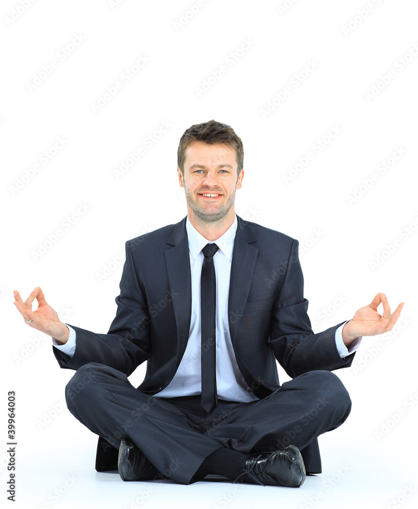 businessman meditating in yoga lotus pose on floor businessman meditating in yoga lotus pose on floor
