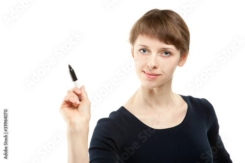 Attractive young woman pointing at something with marker