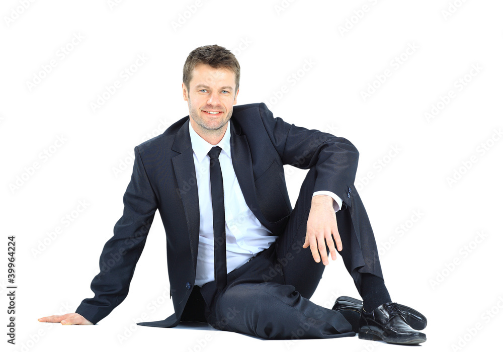 Portrait of business man sitting on the floor isolated Portrait of business man sitting on the floor isolated