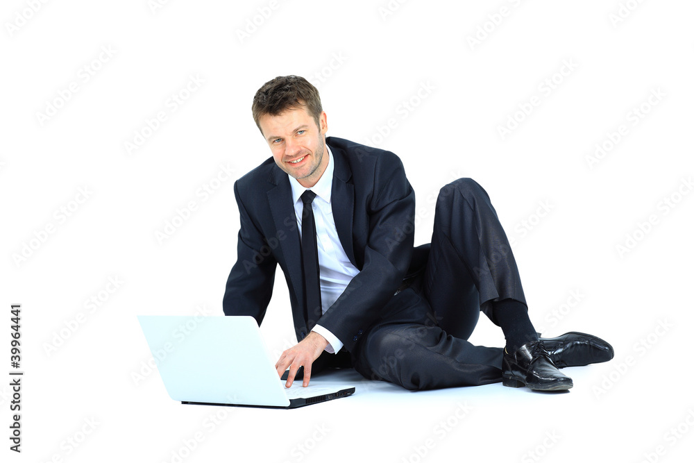 Happy young business man working on a laptop, Happy young business man working on a laptop,