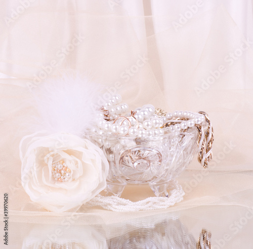 bridal rose with wedding beads in crystal vase