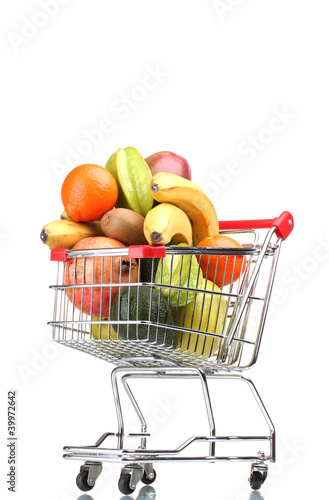Assortment of exotic fruits in shopping cart isolated on white