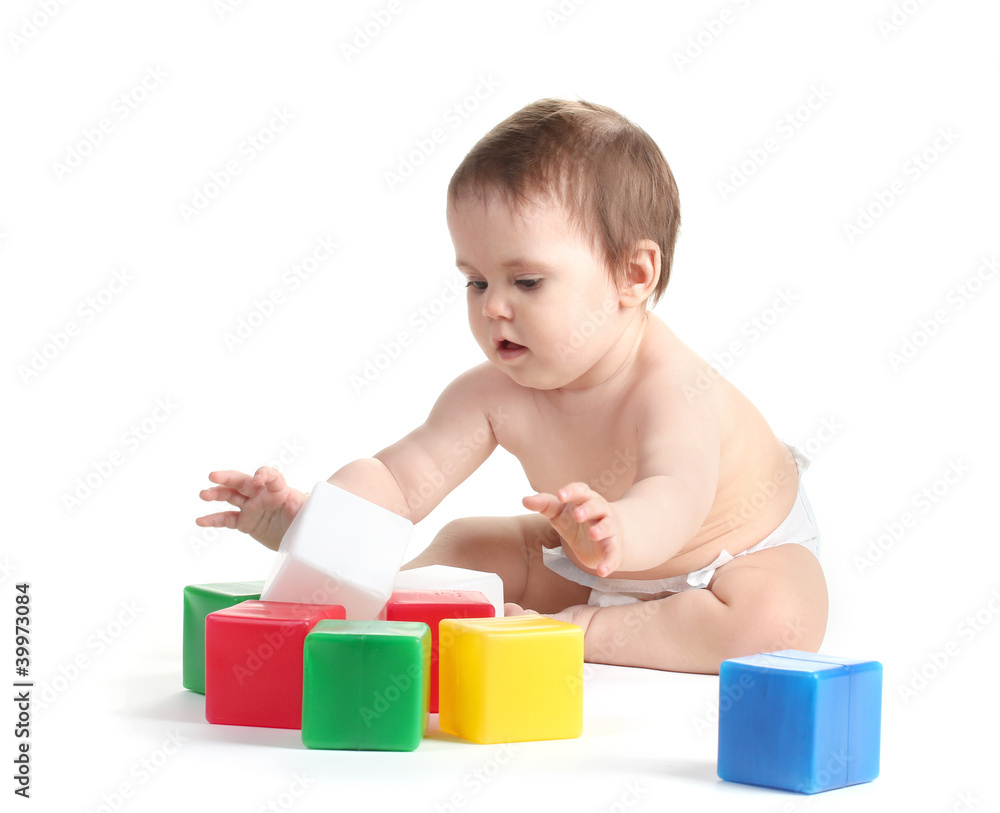 Cute baby girl playing with cubes isolated on white Cute baby girl playing with cubes isolated on white