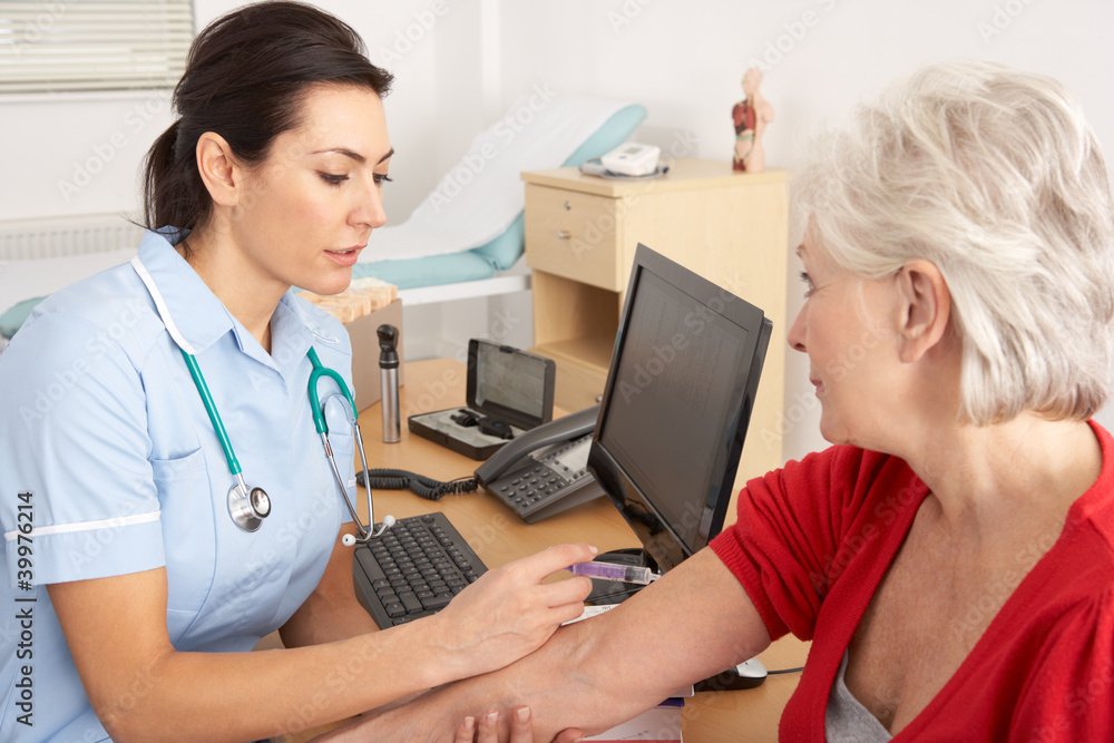 British nurse giving injection to senior woman British nurse giving injection to senior woman