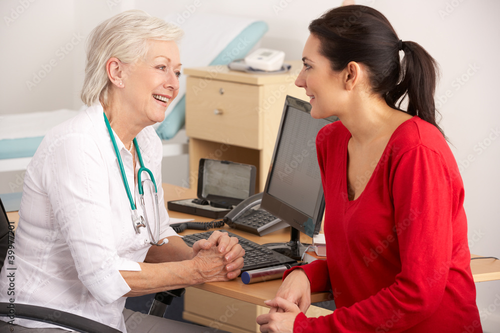 Fototapeta premium British GP talking to woman patient