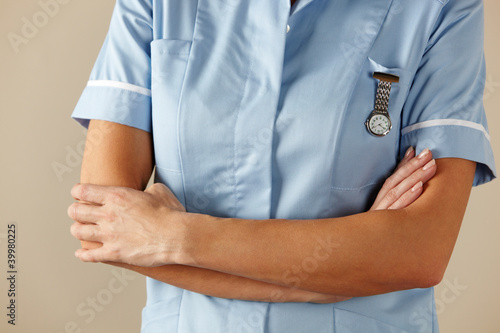 UK nurse standing with arms folded photo