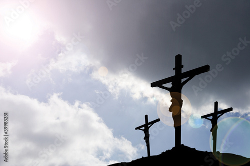 three crosses beneath stormclouds