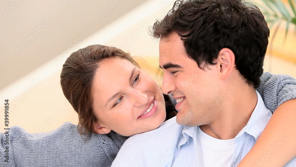 Couple in love are smiling at the camera Couple in love are smiling at the camera