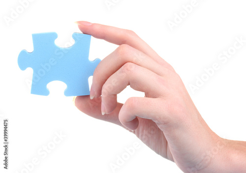 Hand and puzzle, isolated on white