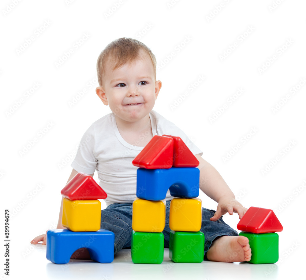 cute little child playing with building blocks isolated on white cute little child playing with building blocks isolated on white