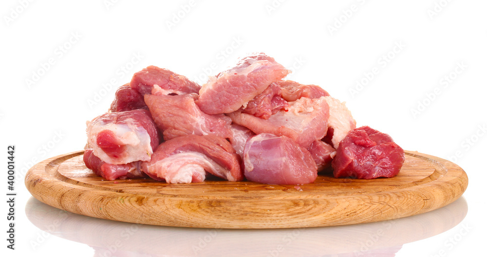 Pieces of raw meat on wooden board isolated on white