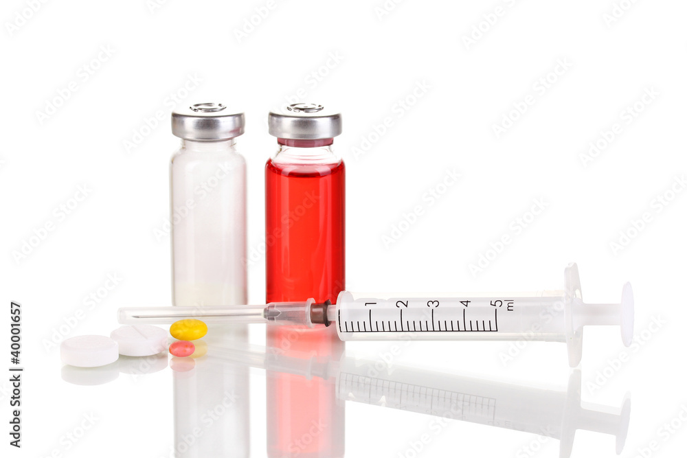 Syringe with medical ampoule and tablets isolated on white Syringe with medical ampoule and tablets isolated on white