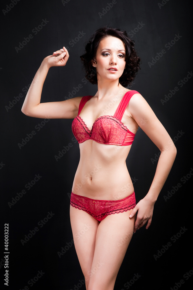 Fototapeta premium girl in red underwear on black background