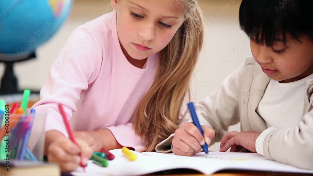 Pupils coloring together Pupils coloring together
