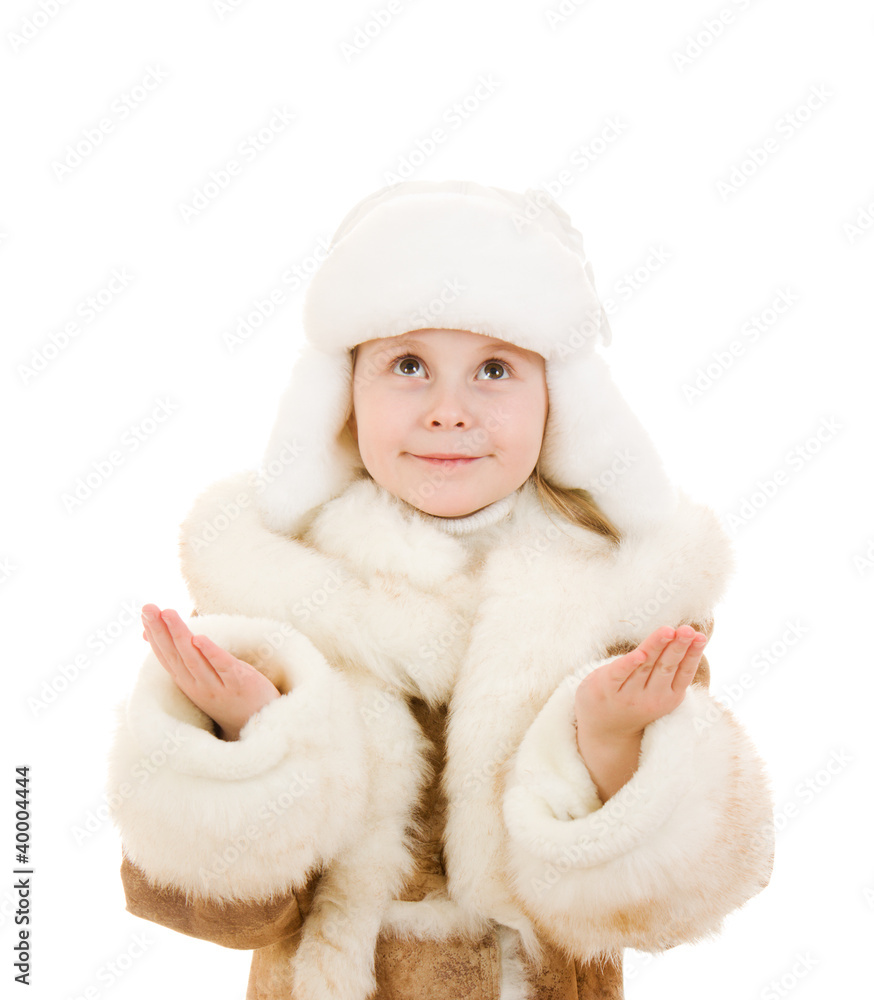 A girl in a fur coat and hat smiling on white background. A girl in a fur coat and hat smiling on white background.