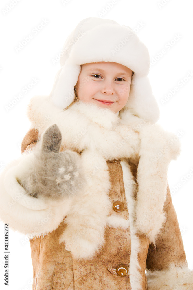 Girl in a gesture of warm clothing shows okay Girl in a gesture of warm clothing shows okay