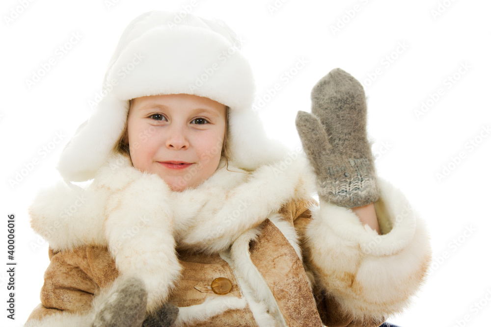 The girl in warm clothes kindly waving a hand The girl in warm clothes kindly waving a hand