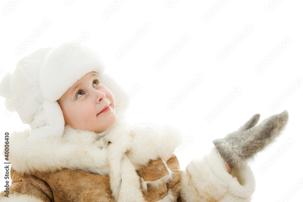 Fototapeta premium The girl in warm clothes in surprise looking up