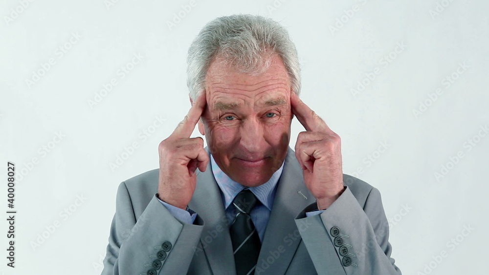 Serious businessman showing his headache Serious businessman showing his headache