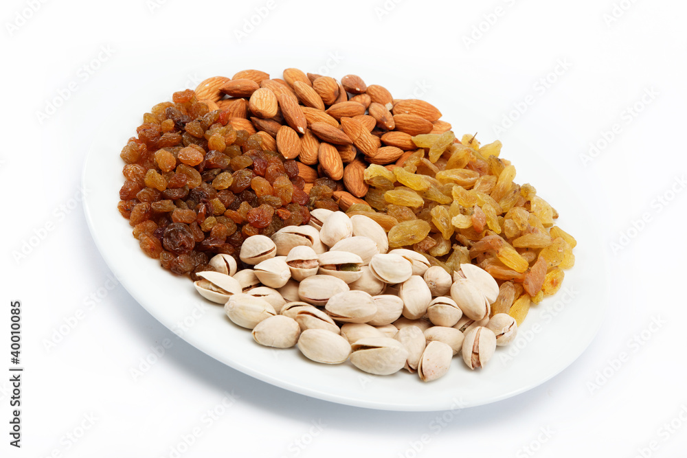 Nut-raisin mix. Almond and pistachio nuts and raisins. Nut-raisin mix. Almond and pistachio nuts and raisins.