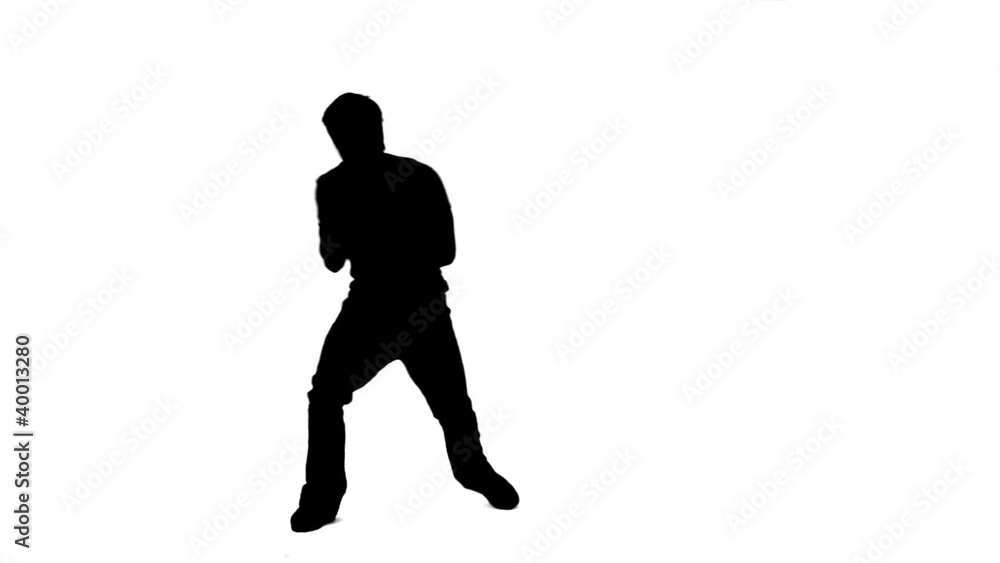 Silhouette of a man singing into a microphone Silhouette of a man singing into a microphone