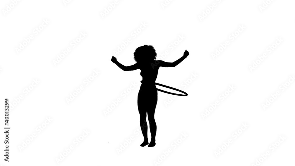 Silhouette of a woman using a hula hoop Silhouette of a woman using a hula hoop