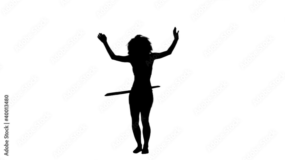 Silhouette woman using a hula hoop Silhouette woman using a hula hoop