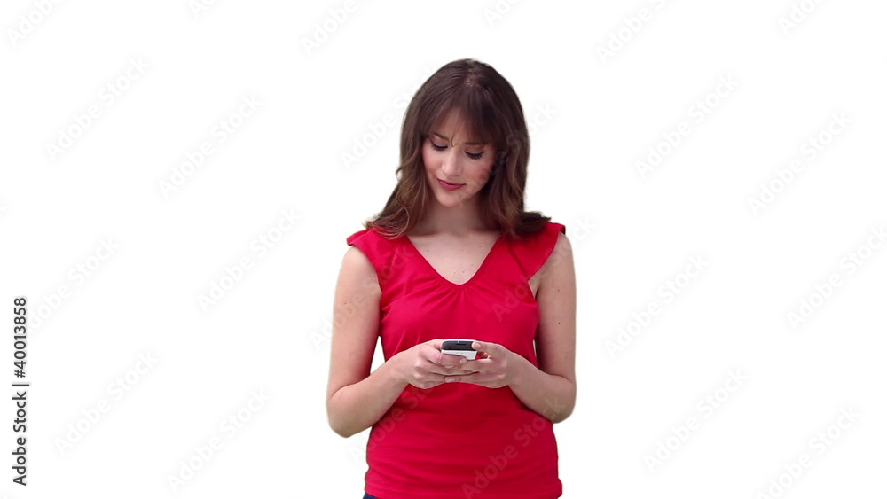 Woman reading a text message before looking to her side Woman reading a text message before looking to her side