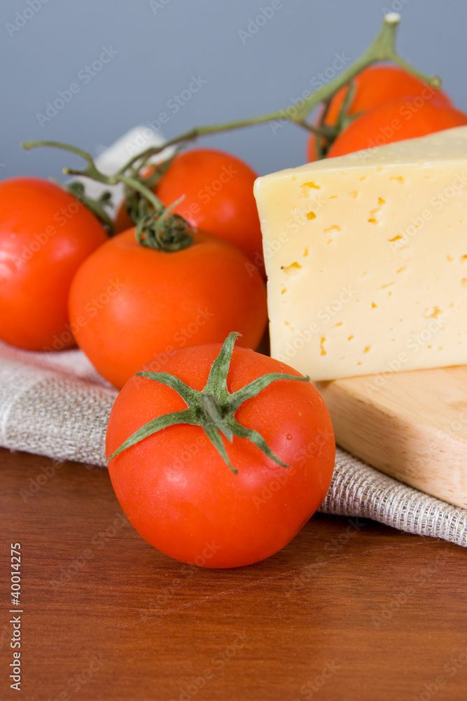 Yellow cheese with fresh tomatoes Yellow cheese with fresh tomatoes