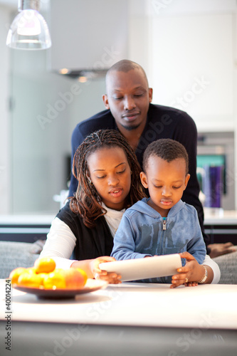 Young black family in fresh modern kitchen