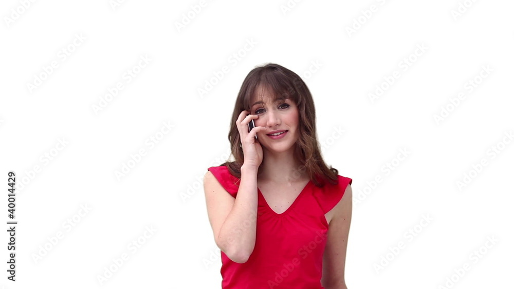 Woman smiling while talking on her mobile phone Woman smiling while talking on her mobile phone